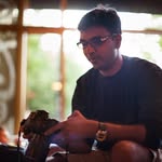 Manohar Srikanth holding a camera